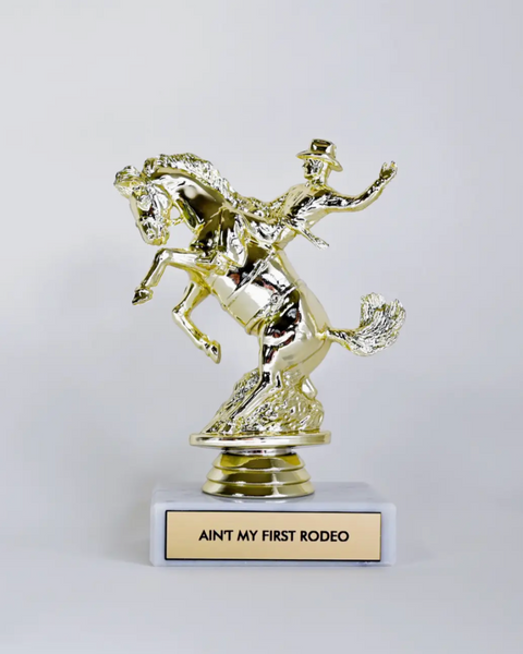 Ain't my first rodeo trophy by Johnny and June sold by Le Monkey House