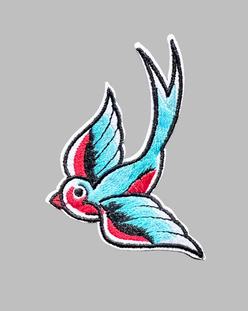 Blue and red, colorful, swallow bird iron on embroidered patch sold by Le Monkey House