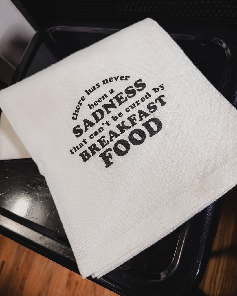 No sadness that can't be cured by breakfast food tea towel designed printed and sold by Le Monkey house