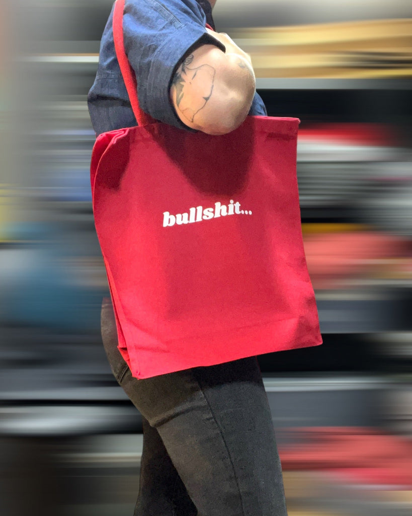Bullshit... red and white canvas tote bag printed designed and sold by Le Monkey House