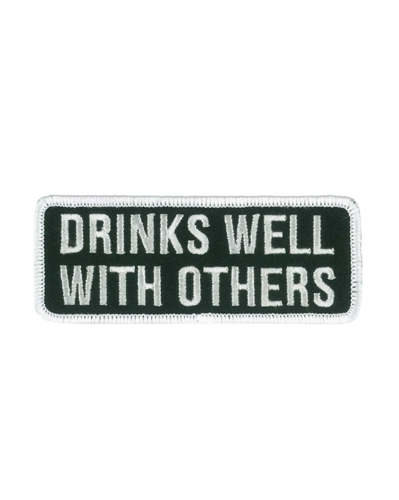 Drinks well with others embroidered black and white iron on patch by hot Leathers sold by Le Monkey House