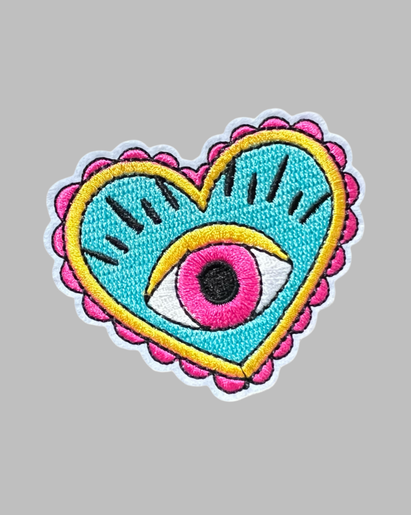Evil eye colorful heart embroidered iron on patch sold by Le Monkey House