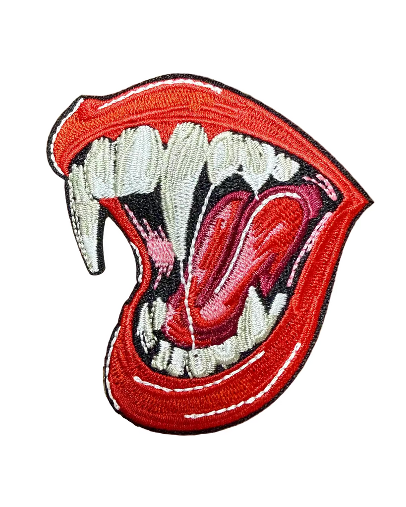 Mouth with fangs and red lips emrboidered iron on patch sold by Le Monkey House