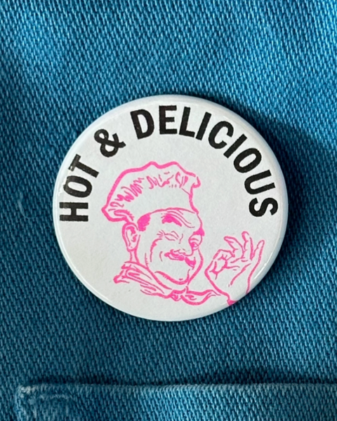 Hot & Delicious chef's kiss button by World Famous Original sold by Le Monkey House