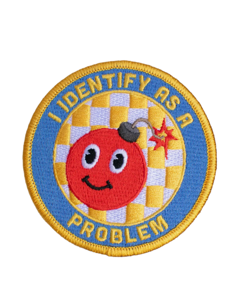 I Identify as a problem  bomb embroidered twill iron on patch by Retrograde supply sold by Le Monkey House