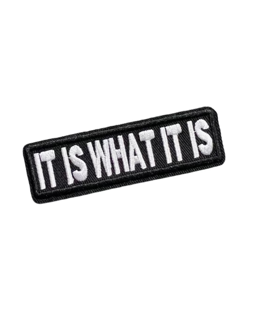It is what it is black and white embroidered iron on patch sold by Le Monkey House
