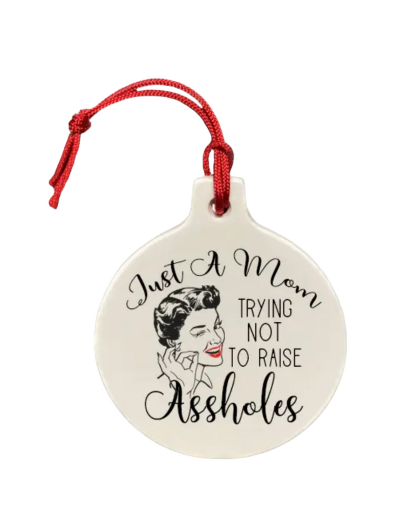 Just a mom trying not to raise assholes porcelain round Holiday Ornament by The Cheeky Tree sold by Le Monkey House