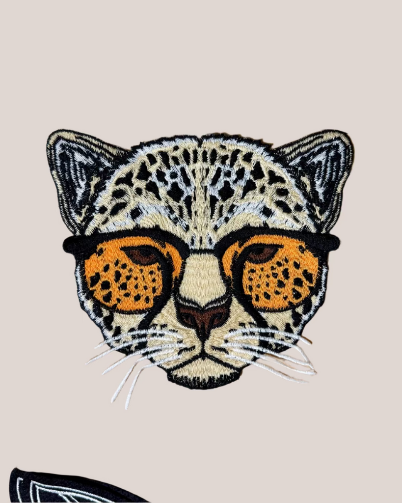 Large leopard in sunnies embroidered iron on patch sold by Le Monkey House
