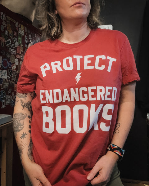 Protect Endangered Books t shirt down with banned books lightning bolt tee designed printed and sold by Le Monkey House