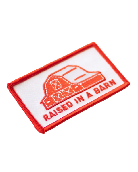 Raised in a barn red and white patch by Union Made sold by Le Monkey House