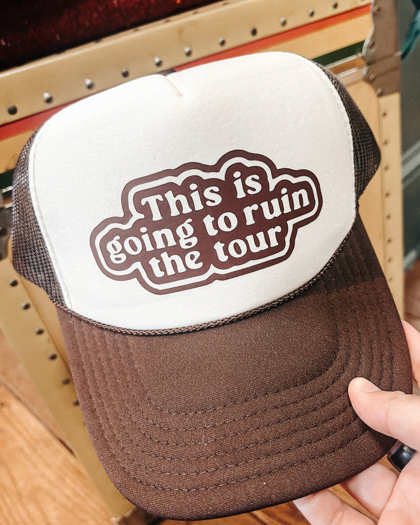 This is going to ruin the tour foam front mesh trucker hat in brown and cream printed and sold by Le Monkey House