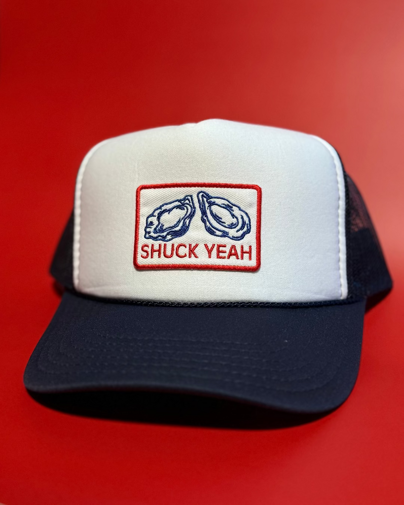 Shuck Yeah trucker hat embroidered red white and blue oyster shell patch assembled and sold by Le Monkey House