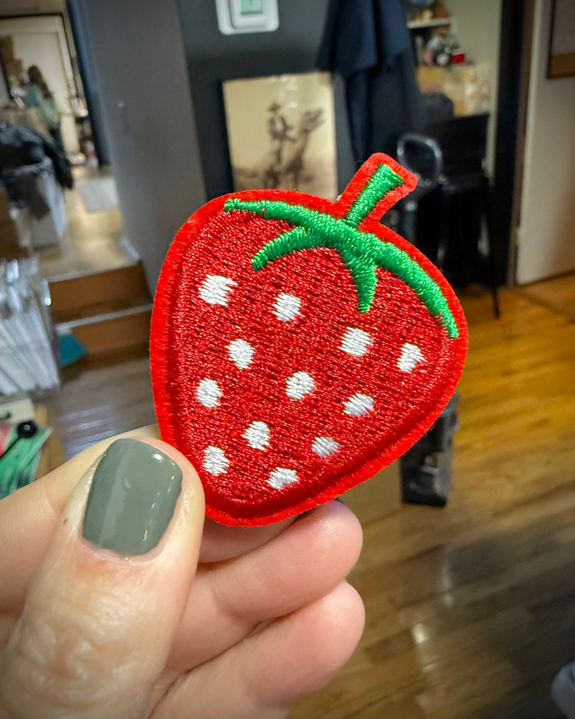 Cute little strawberry iron on patch sold by Le Monkey House