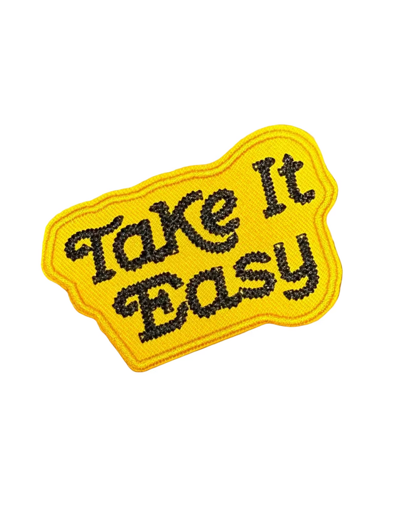 Take it easy black and yellow embroidered iron on patch sold by Le Monkey House