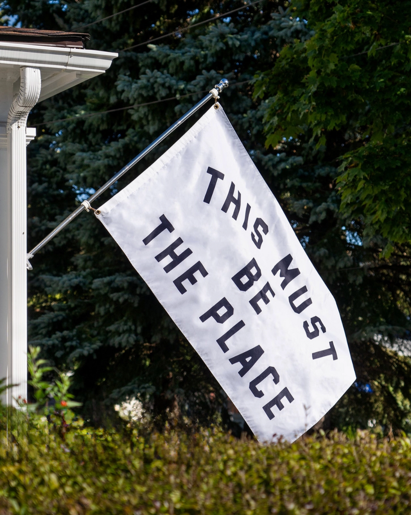 This must be the place outdoor flag, by Oxford Pennant, sold by Le Monkey House