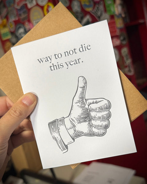 Way to not die this year sarcastic funny greeting card design printed and sold by Le Monkey House