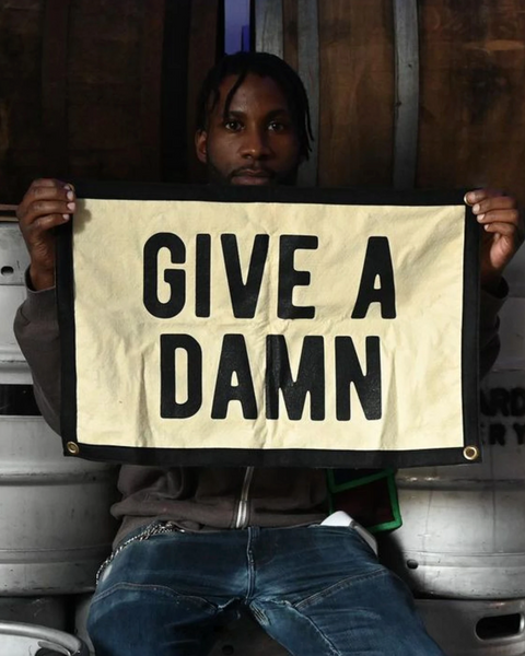Give a damn felt screenprinted camp flag banner by Oxford Pennant sold by Le Monkey House