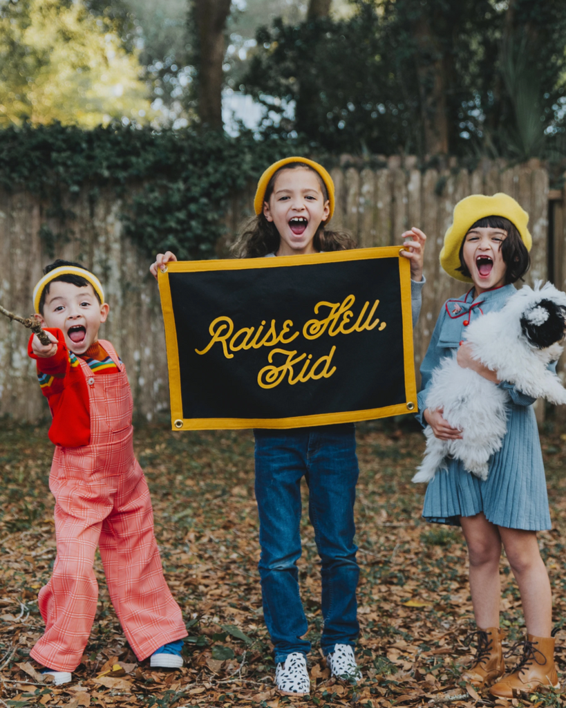 Raise hell kid, black and gold Camp Flag by Oxford Pennant Sold by Le Monkey House