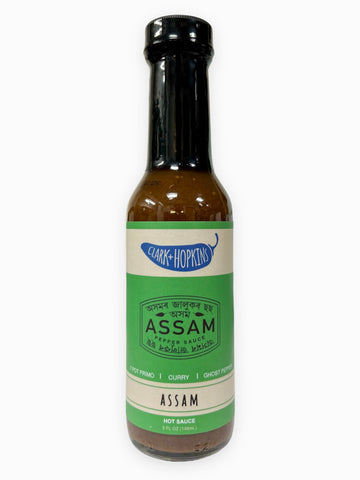 Assam hot pepper sauce ghost pepper, curry, by Clark and Hopkins, Made in Virginia, Sold by Le Monkey House